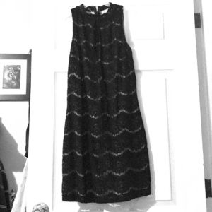 Black lace sleeveless dress.